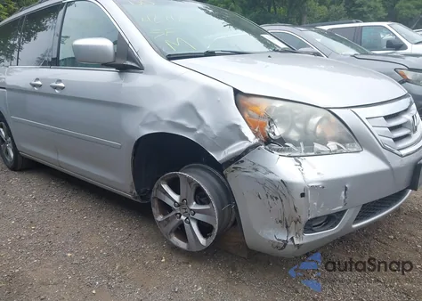 2010 Honda Odyssey Touring z USA, uszkodzony, nr VIN 5FNRL3H9XAB085936